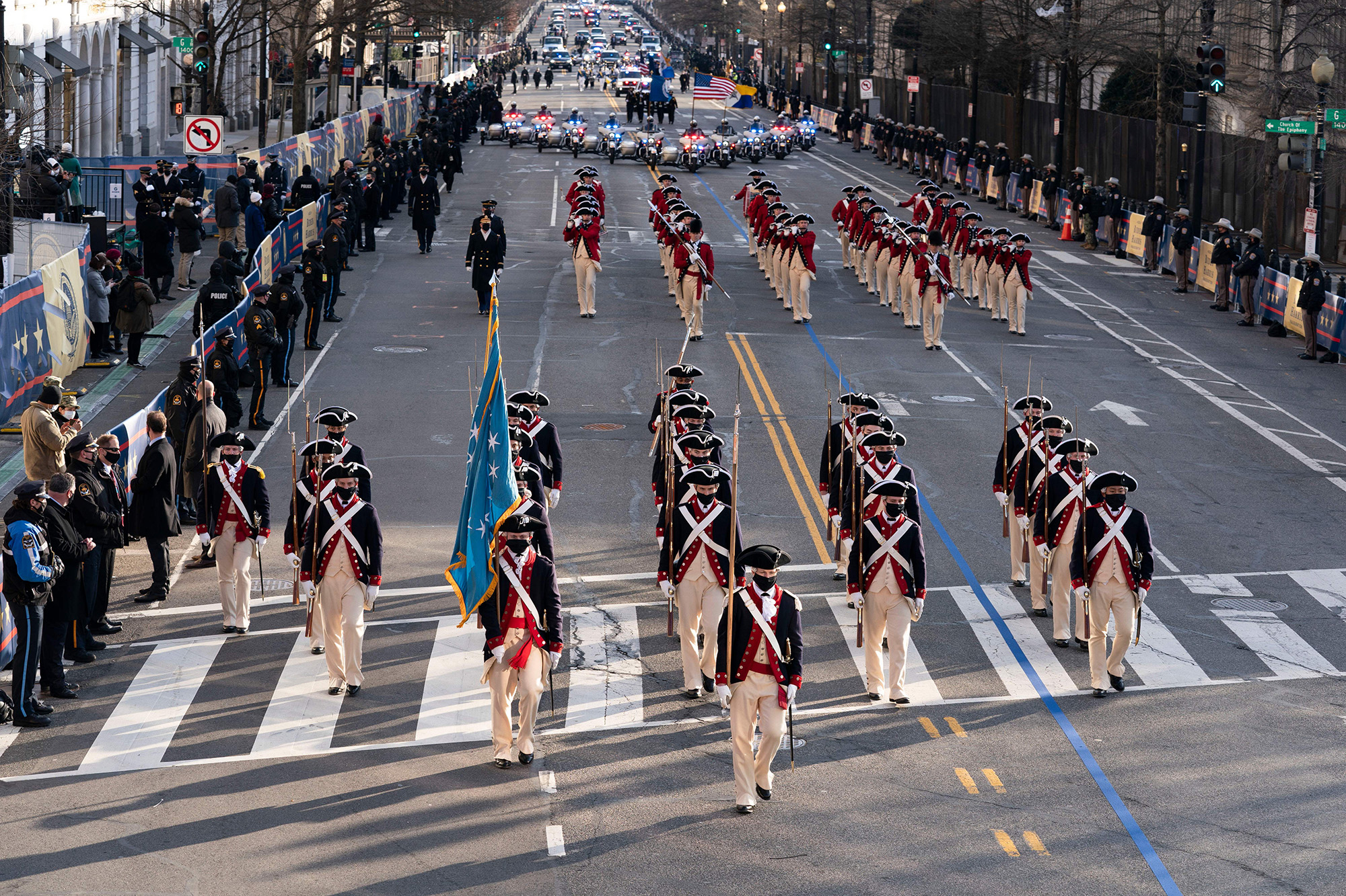 Members of the military march on 15th Street towards the White House during a presidential escort to the White House following President Joe Biden taking the oath of office in Washington on Jan. 20, 2021.